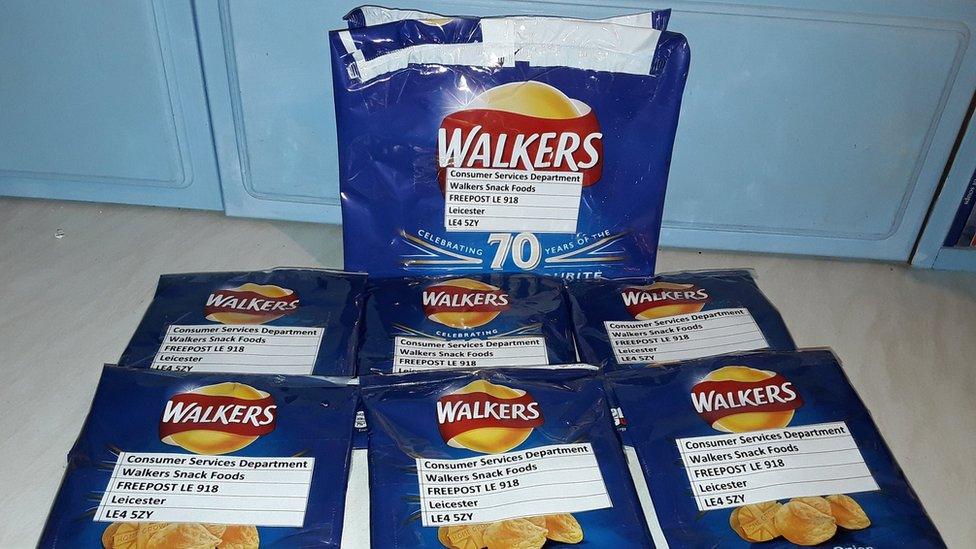 Packets of Walkers crisps labelled up