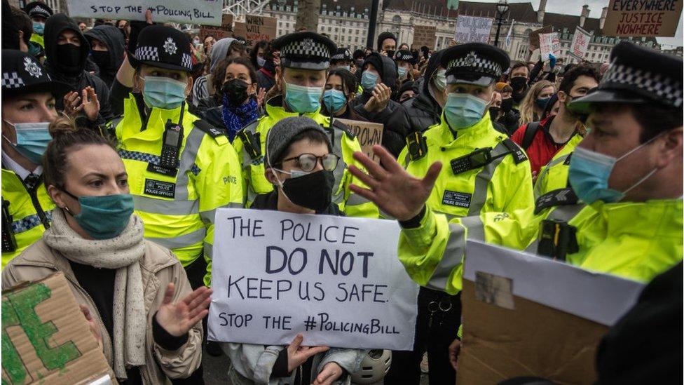 Protestors demonstrate outside Scotland Yard over the treatment of people by police at the Sarah Everard vigil