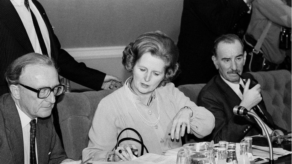 Margaret Thatcher checking documents at the start of the European Council Summit