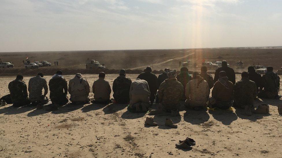 Shia paramilitaries gathered in prayer during pause in fighting IS