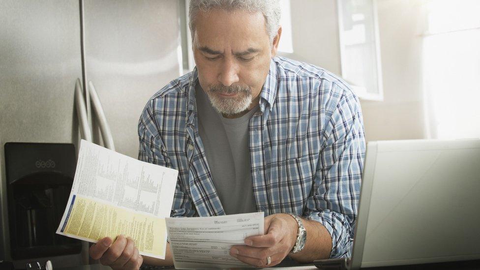 A man looks at documents