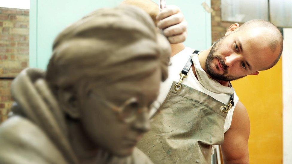 Sculptor Andrzej Szymczyk crafting the statue of Daniel Radcliffe as Harry Potter