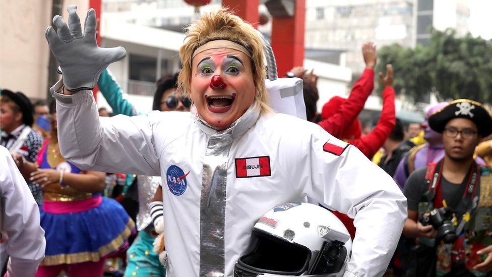 Clown takes part in a parade during Peru"s Clown Day celebrations in Lima, Peru May 25, 2018