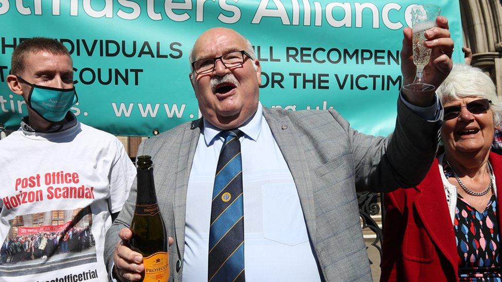 Former post office worker Tom Hedges celebrates outside the Royal Courts of Justice, London, after having his conviction overturned by the Court of Appeal, on 23 April 2021