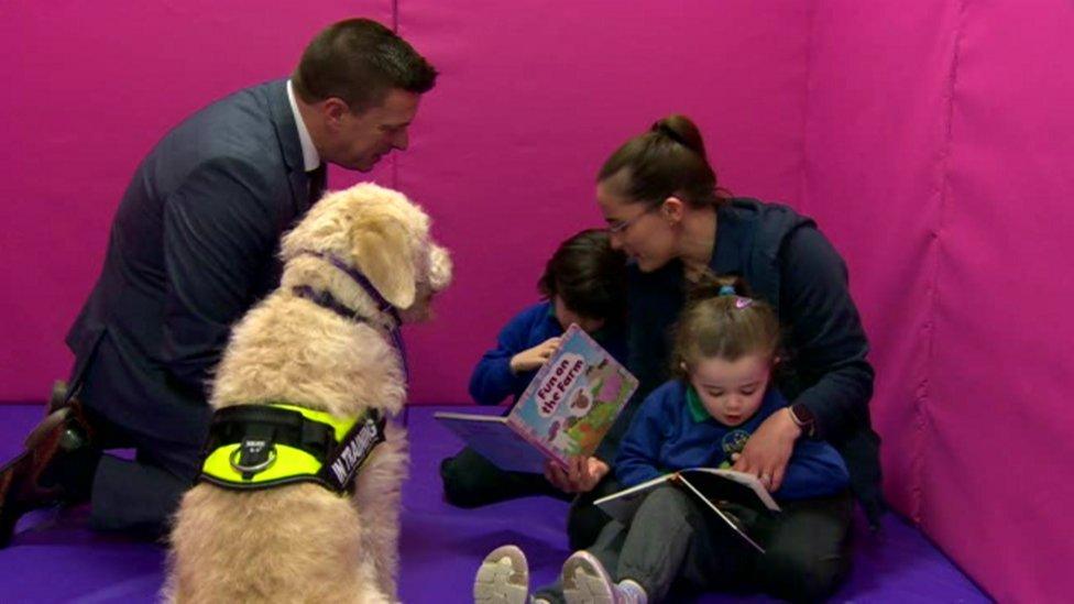 Therapy dog with children