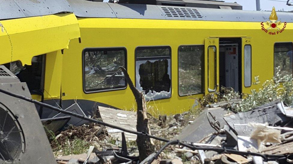 crumpled carriage with broken windows and debris strewn about, 12 July 2016