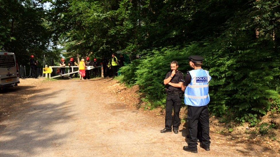 Police at the entrance to the oil exploration site at Leith Hill, Surrey