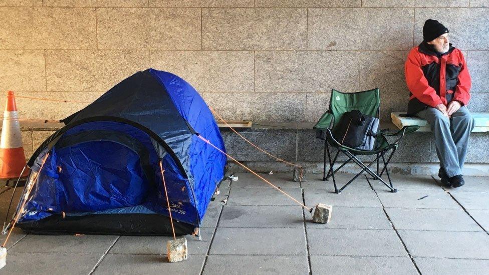 Homeless man an his tent