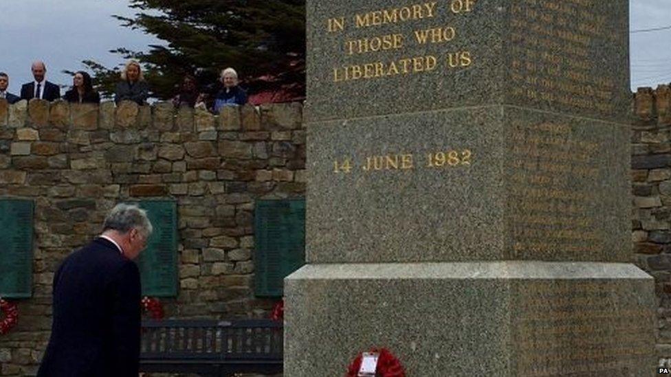 Michael Fallon at the Liberation monument in Stanley, in the Falklands (17/02/2016)