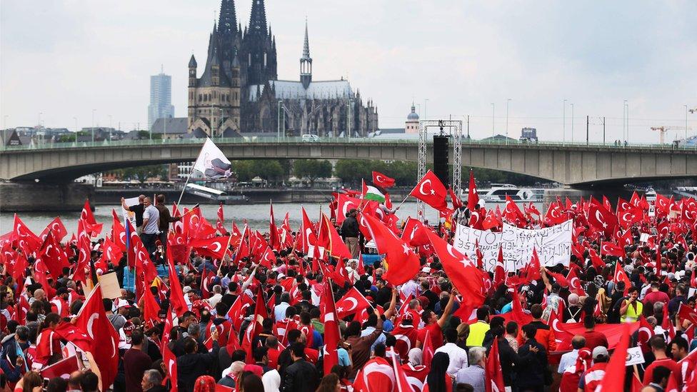 Supporters of Turkish President Recep Tayyip Erdogan attend a rally on 31 July 2016 in Cologne, as tensions over Turkey's failed coup put authorities on edge.