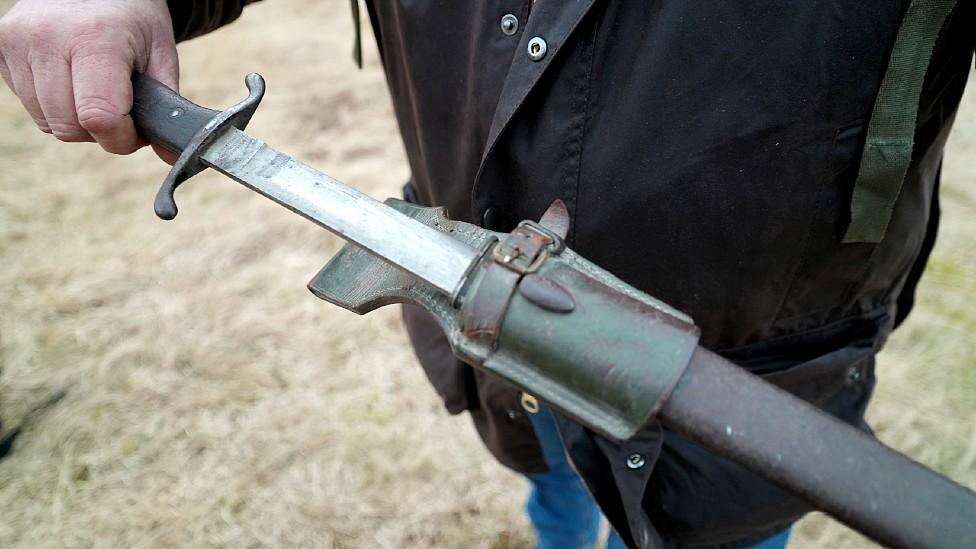 Nigel Ely holding a knife