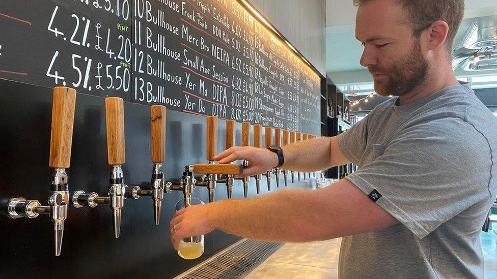 William Mayne pouring a pint in Bullhouse East