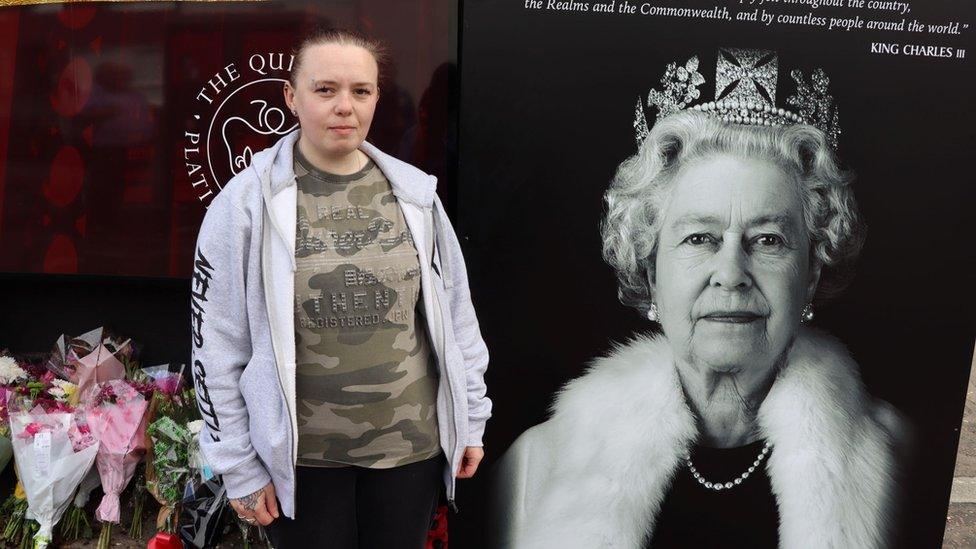 Gemma Davison on Shankill Road beside Queen mural