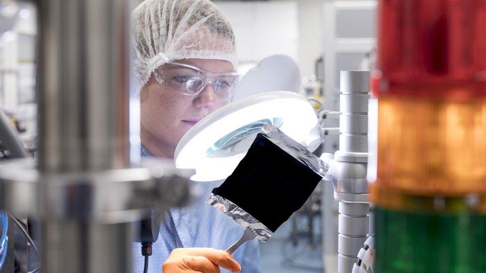 Scientist with sample of Vantablack in the lab