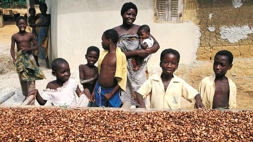 Woman surrounded by children