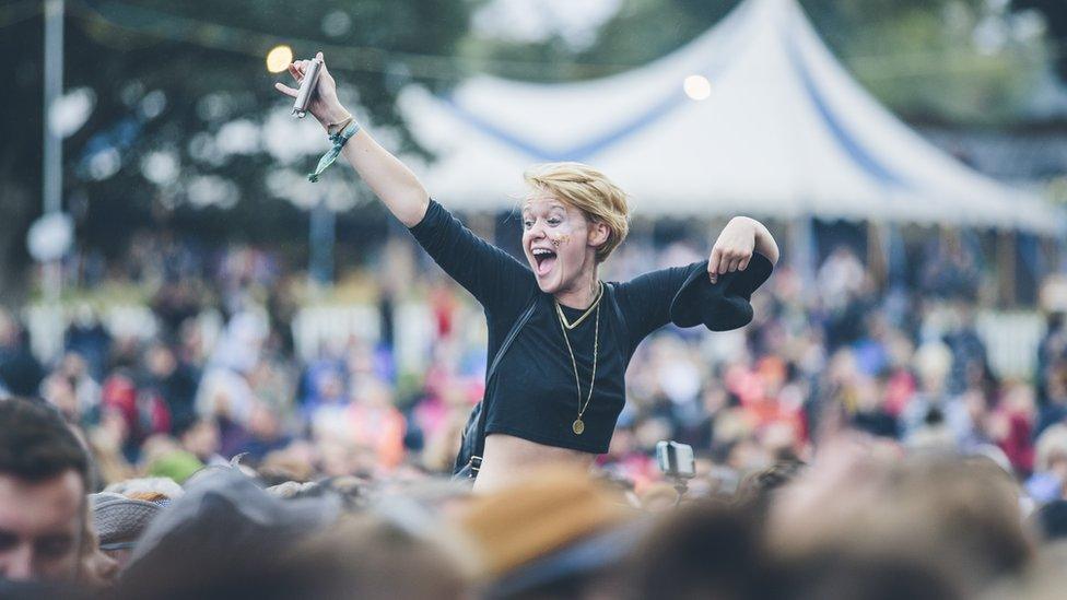 A festival-goer enjoys the view at Festival No 6.