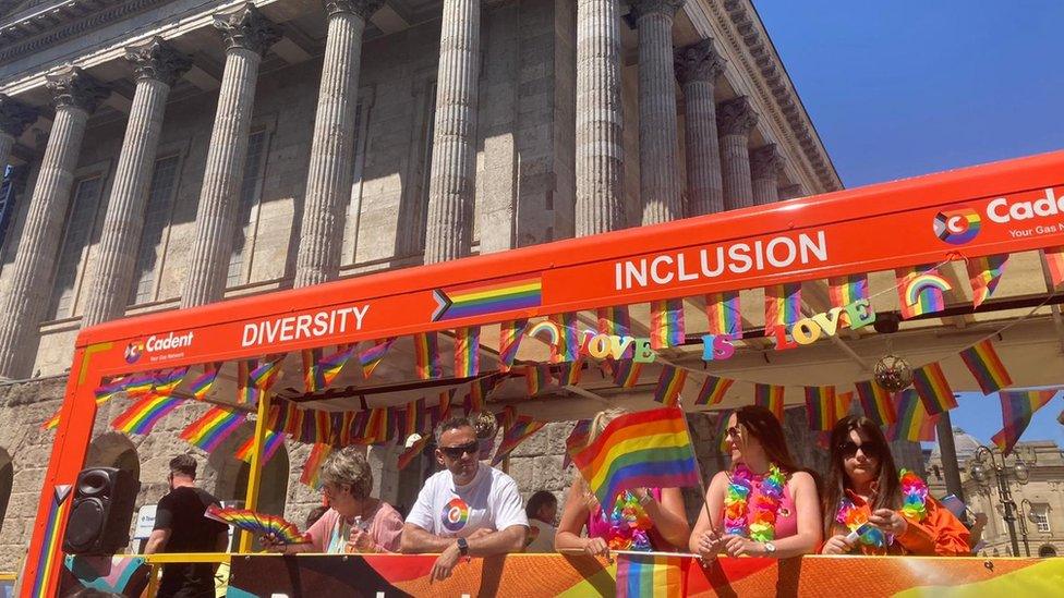 People on a Pride bus