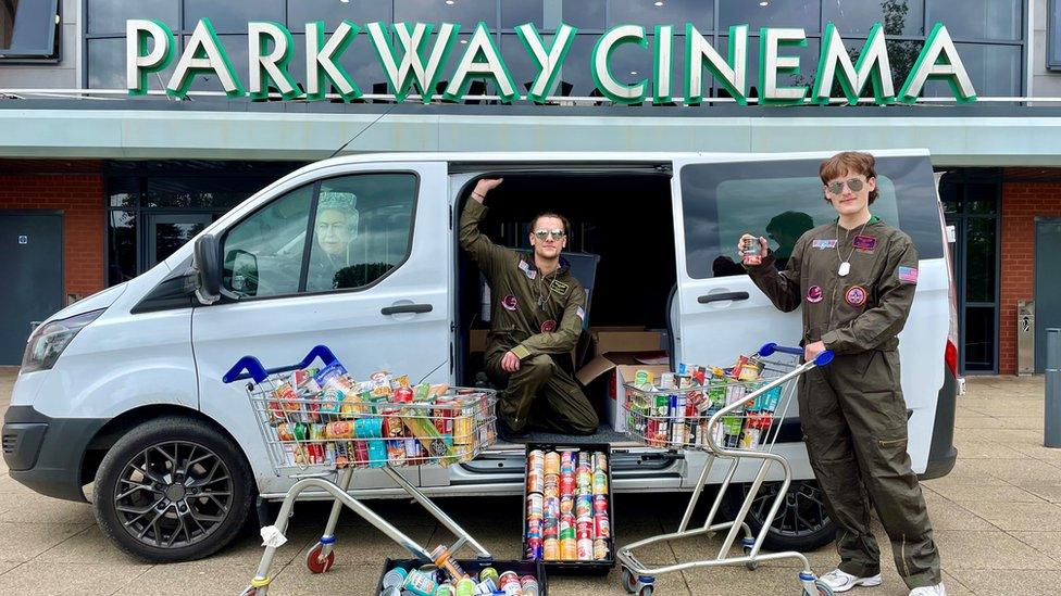 Staff dressed up as Top Gun pilots to deliver the donations to food banks