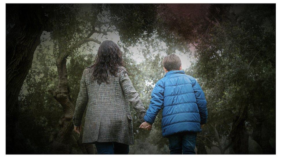 Mother and son walking