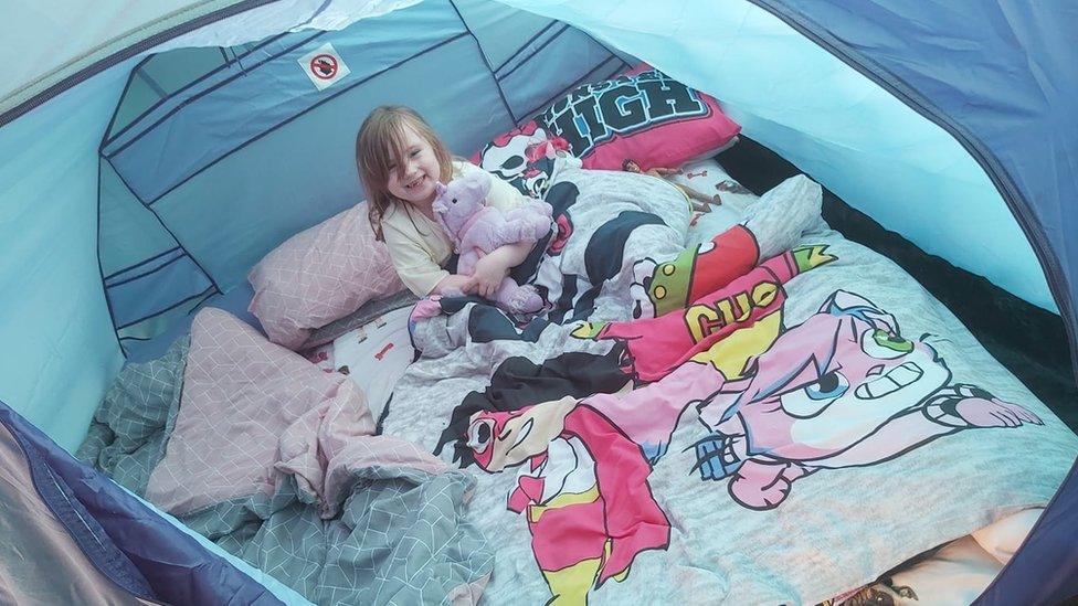 Emma Kyson , five, camping in Swindon, Wiltshire