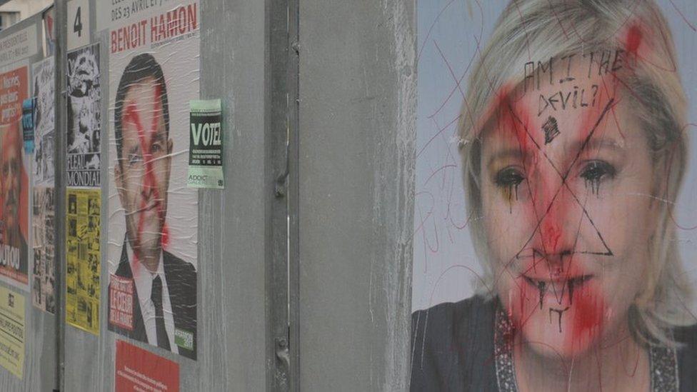 A vandalised poster of Marine Le Pen