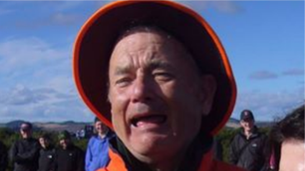 Facebook post of a baby crying with Bill Murray scrunching up his face similarly behind