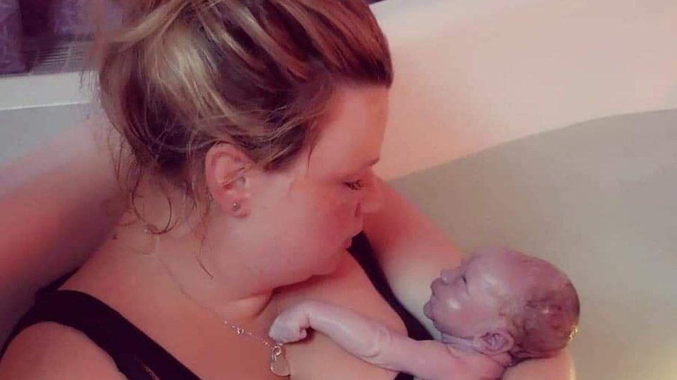 Claire Rudge and her baby in a birthing pool