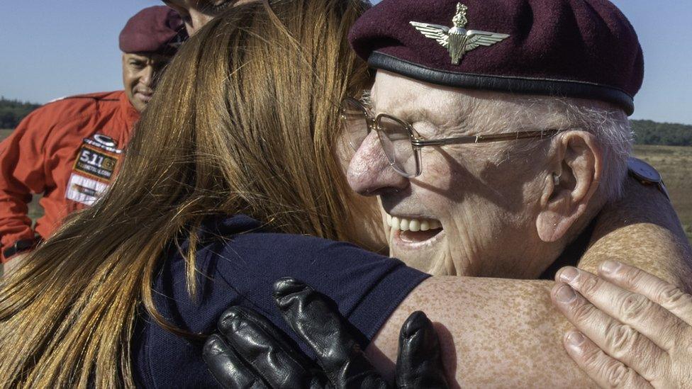 Veteran Sandy Cortmann, 97, getting a hug from his carer, Arlene Campbell just after his tandem jump.