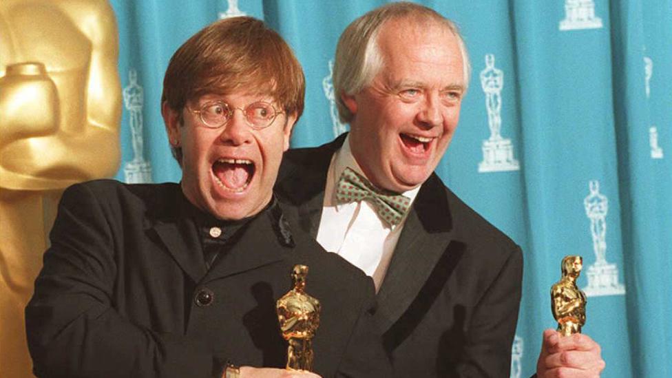 Elton John and Tim Rice with their Oscar trophies in 1995