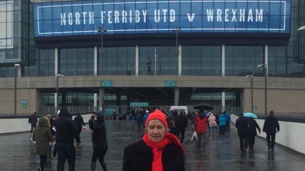 Flo outside a ground