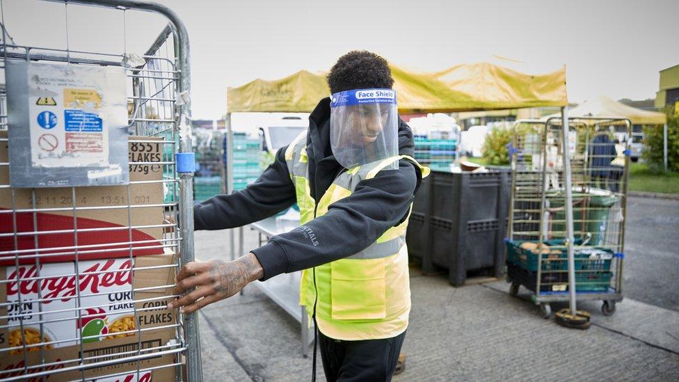 Marcus Rashford working at a food bank