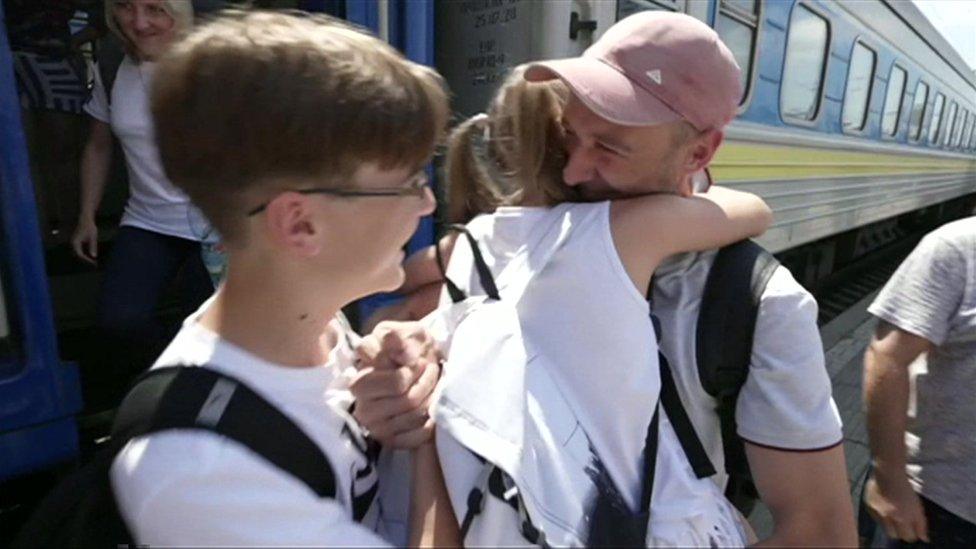 Families reuniting at train station