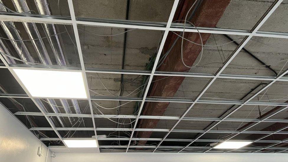 The cracked concrete ceiling at the Blue School