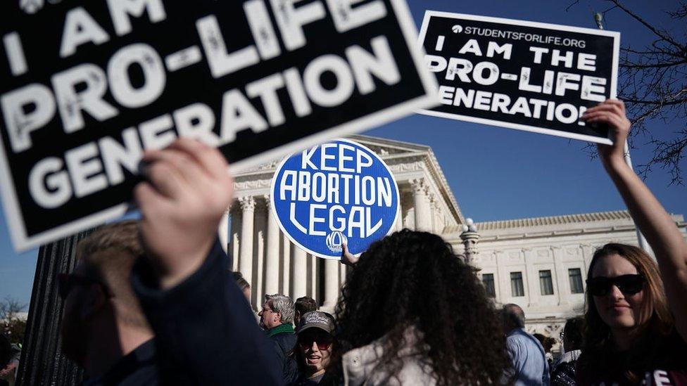 Anti-abortion and pro-choice placards