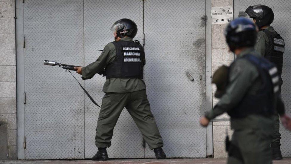 Members of the Bolivarian National Guard trough tear gas against protesters near the Cotiza Bolivarian National Guard headquarter in Caracas, Venezuela on January 21, 2018.