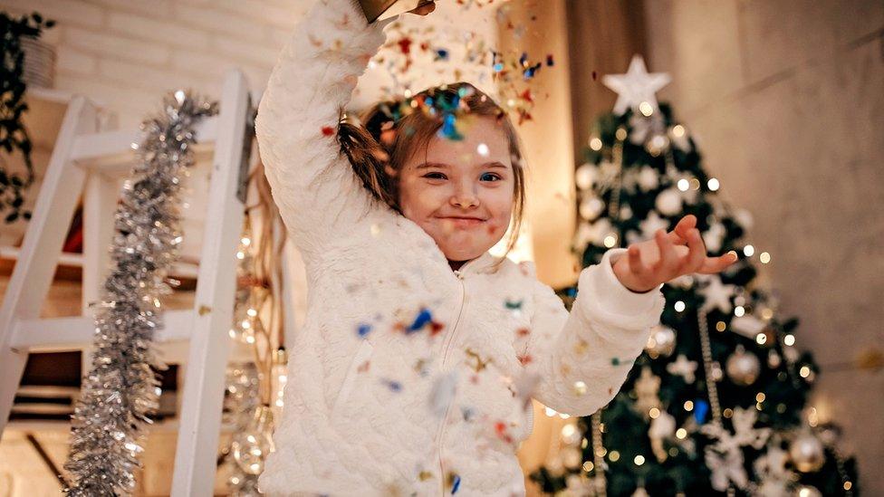 Girl with glitter and Christmas tree