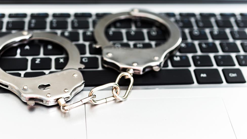 Handcuffs on keyboard