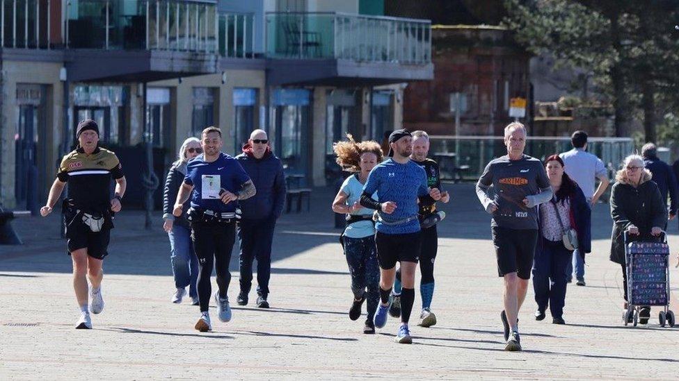 Chris Young (second left) with supporters running through Whitehaven