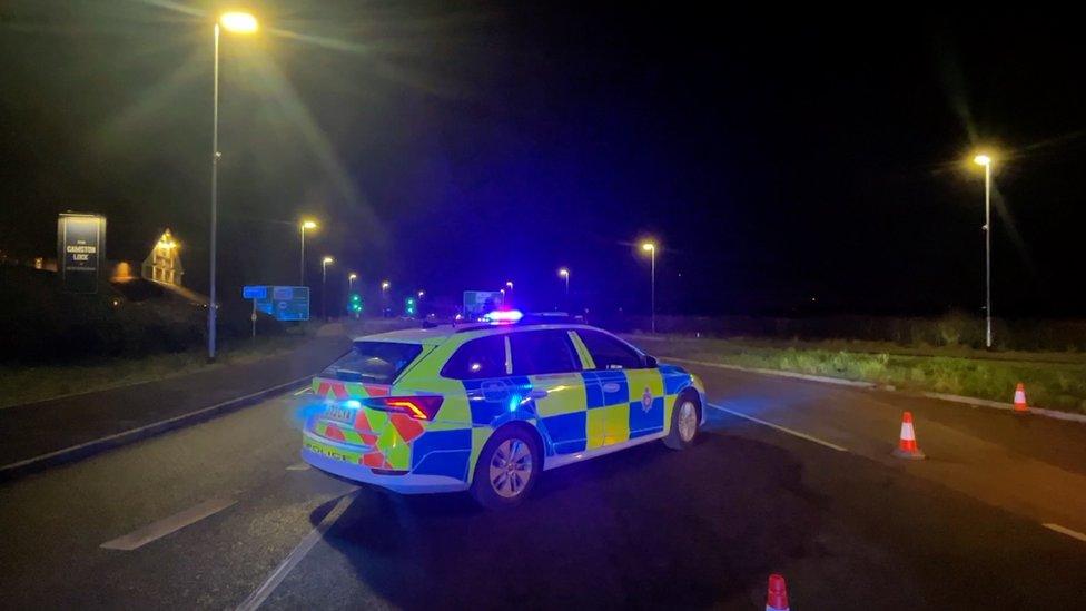 Police car at scene of crash