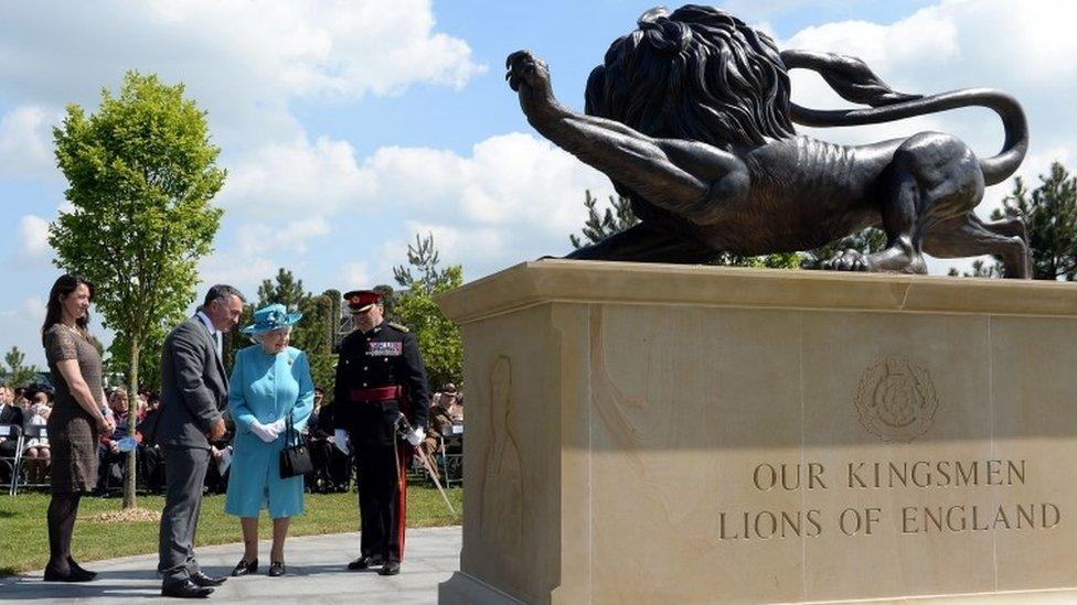 Queen Elizabeth II views the new Duke of Lancaster's Regimental memorial during a service at the National Memorial Arboretum in Alrewas, Staffordshire.