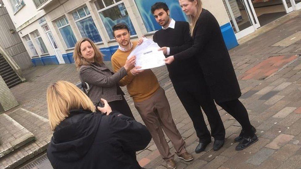 Lalys staff handing in petition