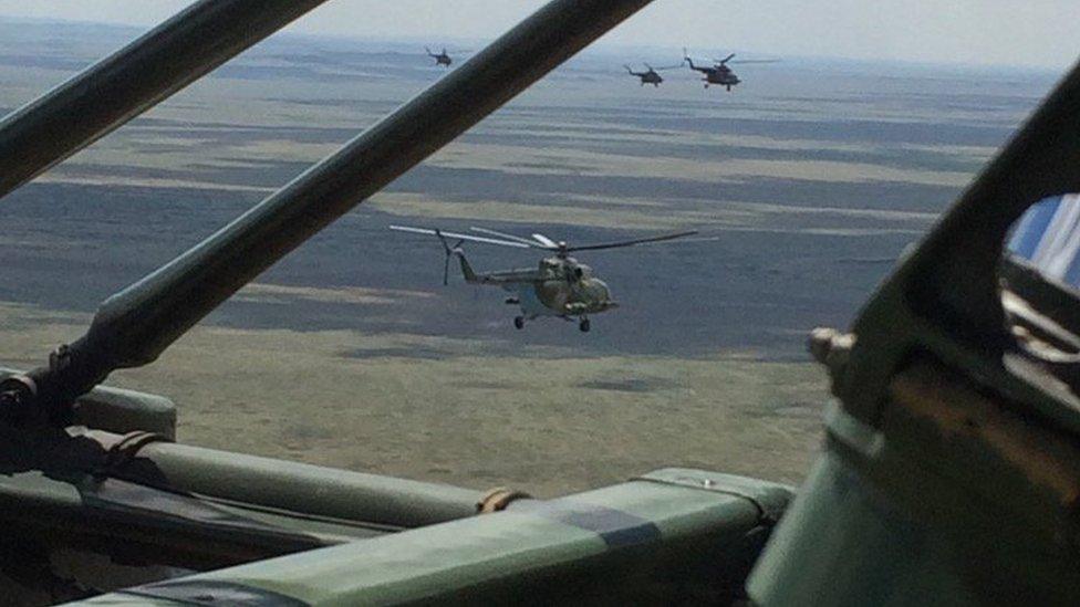 Helicopters flying to Soyuz landing zone