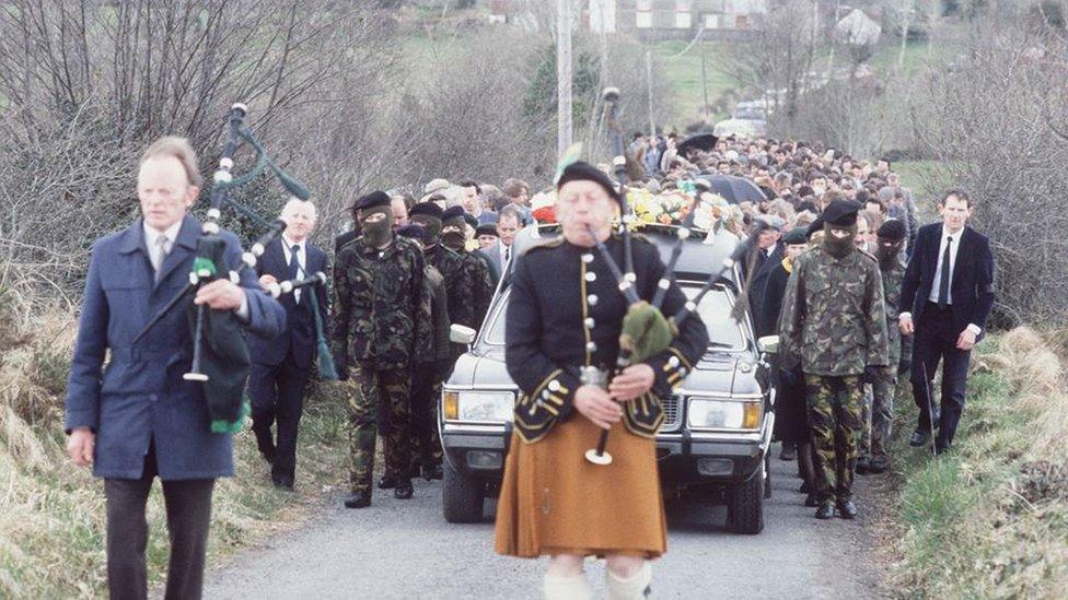 A piper leads the funeral for Seamus McElwaine