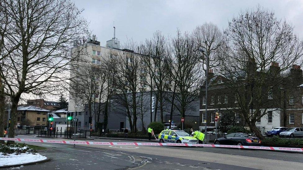 A police car can be seen inside the cordon in Walthamstow