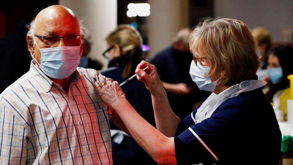 A man in St Albans receives a vaccine dose