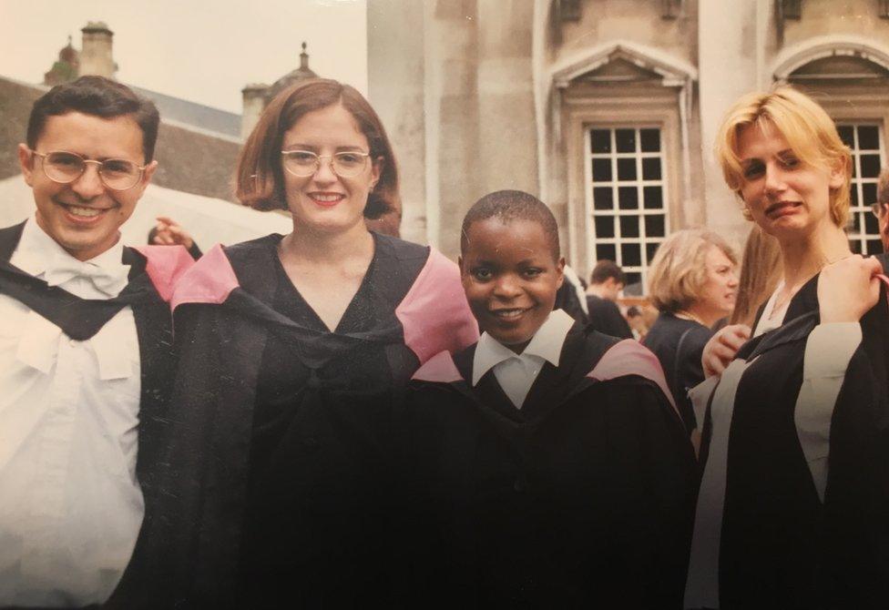 The author with friends on graduation day at the University of Cambridge in the UK