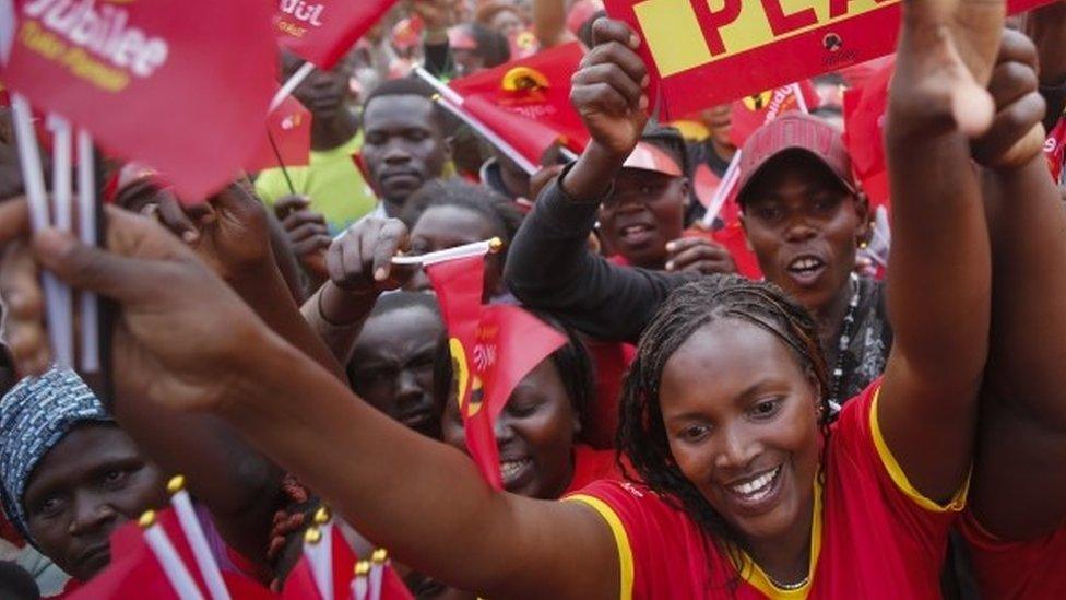 Supporters of Kenyan President Uhuru Kenyatta and his Jubilee party cheer as Kenyatta arrives for the camapaign rally in Nairobi,