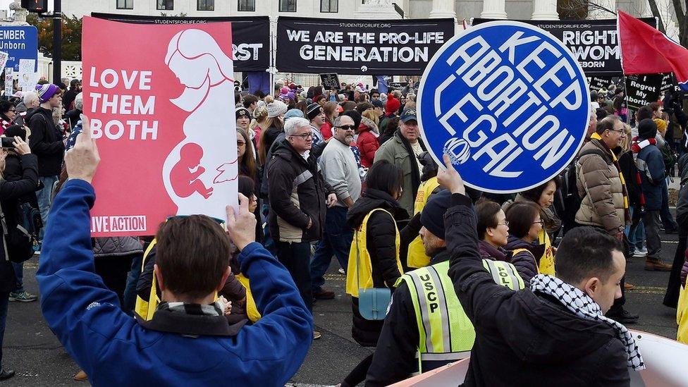 Pro-choice and anti-abortion protesters rally outside the US Supreme Court