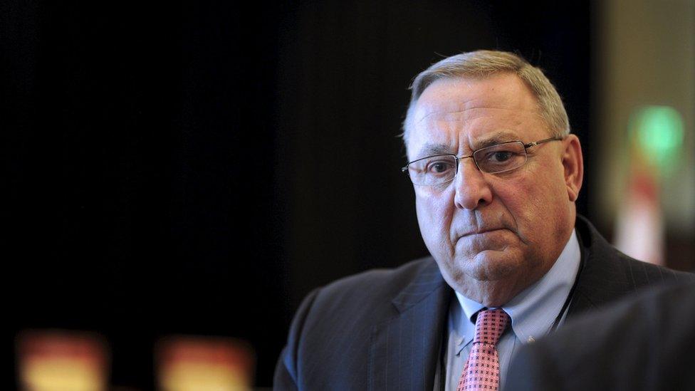 Maine Governor Paul LePage listens while speaking with an attendee to the 23rd Annual Energy Trade Technology Conference in Boston