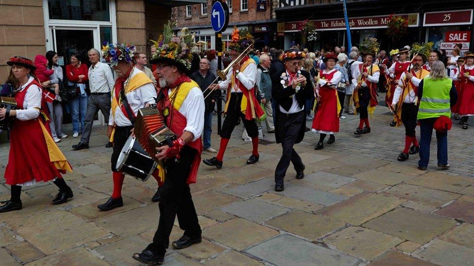 Morris dancers parading through Shrewsbury